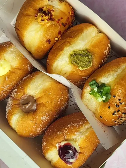 An assorted box of my mini bombolinis, perfect for celebrations or when you want to try a little bit of everything. This box features both sweet and savory options.