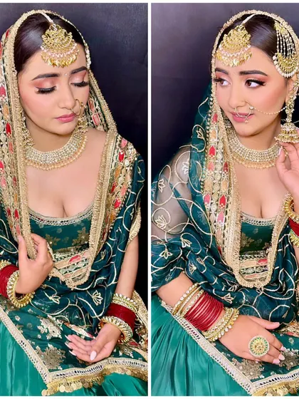 A stunning Punjabi bride in a deep green outfit. The makeup features soft, shimmery eyes and a nude lip, allowing the rich colors of her attire and jewelry to stand out.