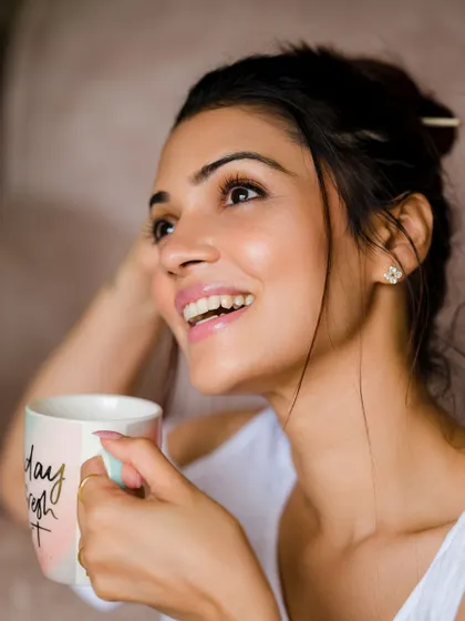 A bright, happy smile. This shot is full of warmth and positive energy.