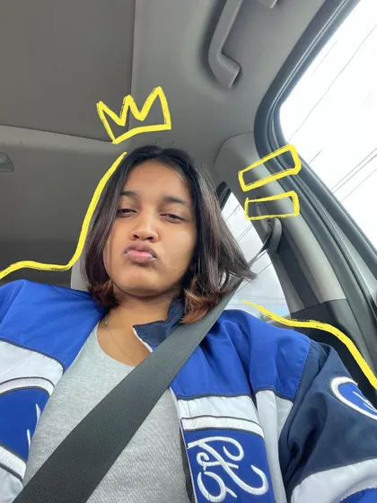 A goofy car selfie with a yellow crown doodle because why not.