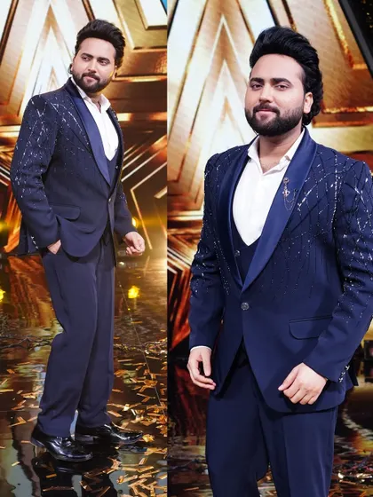 Singer Mohd. Danish looking dapper on the set of Super Star Singer 3 in our navy blue tuxedo with sparkling shoulder embellishments.