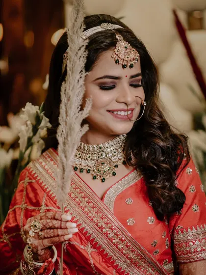A happy, smiling portrait of Reewa on her wedding day.