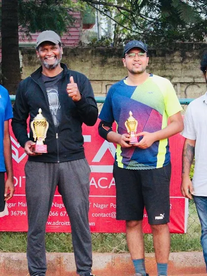 The thrill of the final point. Here are the winner and finalist from a hard-fought Just-Am singles title match, showcasing the competitive spirit of our amateur tennis championship.