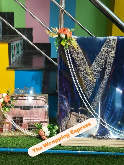 A royal blue velvet suit packed for a wedding function. The rich color of the fabric is highlighted by the simple yet elegant pearl string and floral arrangement.
