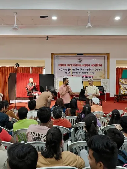 Interacting with the audience and answering questions during the portrait demonstration in Nashik. I believe teaching is as important as creating.