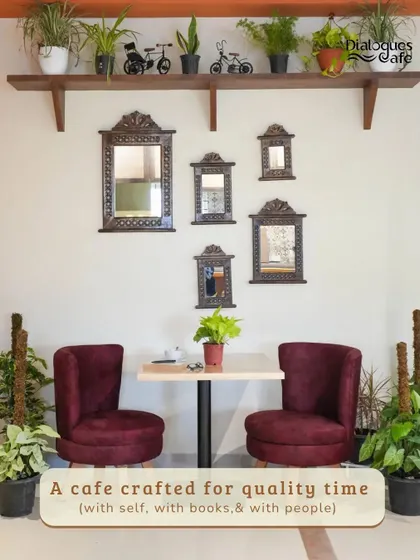 This little corner is crafted for quality time, whether it's with a good book, a close friend, or just your own thoughts. The plush chairs and surrounding greenery make it a perfect escape.