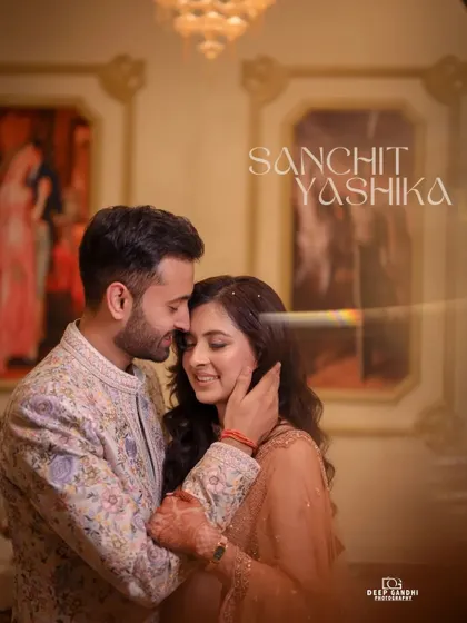 A tender moment captured during the engagement shoot. The groom gently holds the bride's face, their smiles reflecting their happiness.