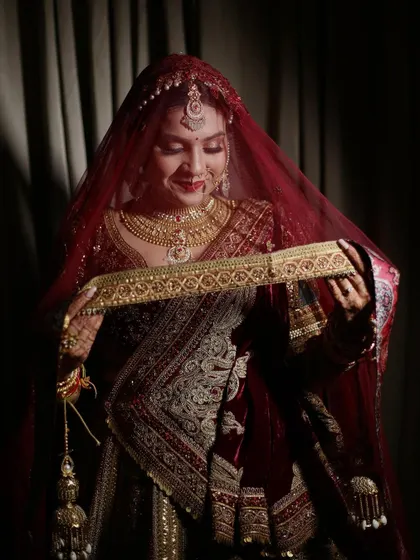 A beautiful shot of the bride holding her wedding belt. The details are just exquisite.