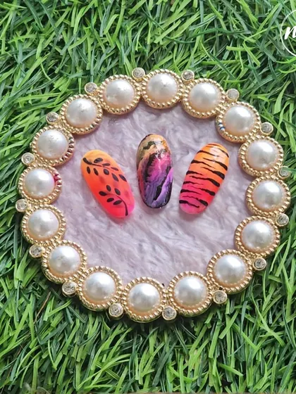 A beautiful set of hand-painted designs by one of my students. They've combined a sunset-inspired ombre with animal prints and leafy silhouettes.
