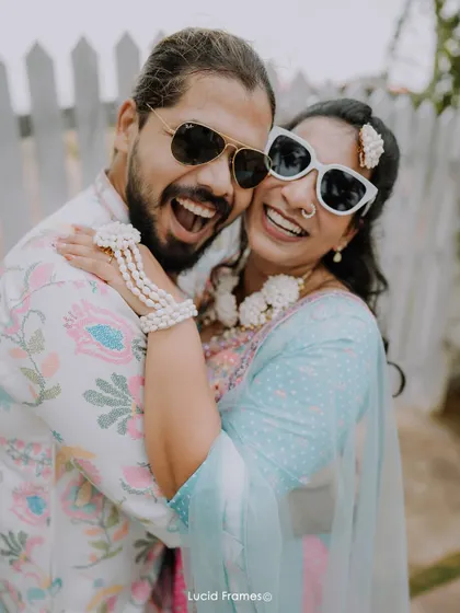 A joyful, sun-kissed hug. The energy and happiness of a Haldi ceremony are perfectly captured in this candid shot.