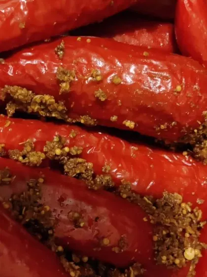 A close-up of our stuffed red chilli pickle. These are spicier than the green ones and have a deep, robust flavour that pairs perfectly with paranthas.