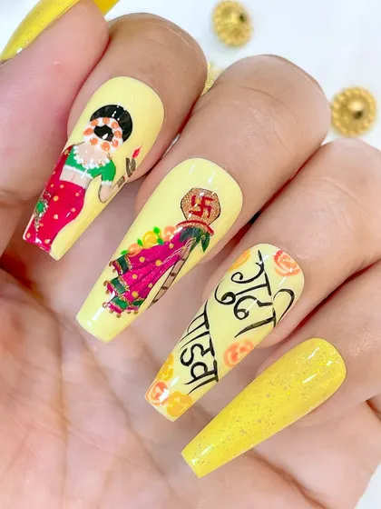 A beautiful Gudi Padwa themed nail art set, featuring a hand-painted Maharashtrian woman, the traditional Gudi, and Marathi calligraphy.