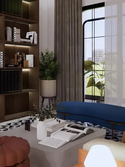 This lounge in Phagwara features a bold black-and-white geometric floor, a dark wood bookshelf, and pops of color in the furniture. It's a vibrant, contemporary space designed for relaxation and socializing.