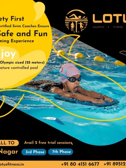 Safety is the foundation of all our swim programs. Here, a child learns basic floating techniques with a kickboard under the watchful eye of our staff, ensuring a secure and fun experience.