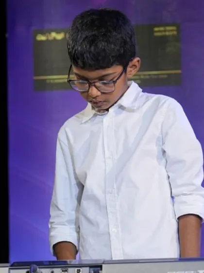 A collection of photos from our keyboard ensemble's performance of 'Chand Sifarish'. These shots capture the focus and joy of our young musicians and their teachers on stage.