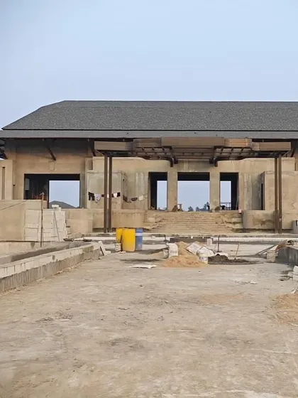 The main structure of our luxury villa project in Bhubaneswar taking shape. This image captures the building's strong, grounded presence and the initial framework that will eventually become an elegant farmhouse blending comfort with sophisticated design.