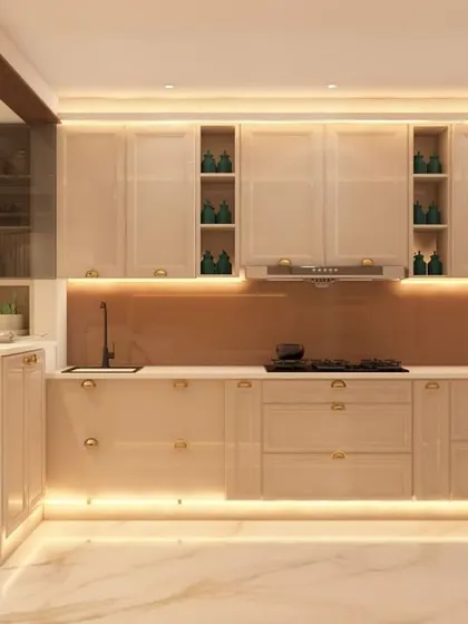 A spacious L-shaped kitchen with glossy beige cabinets and a contrasting brown backsplash. The design includes a breakfast bar with stylish high chairs, seamlessly connecting the kitchen to the living area.