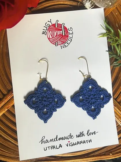 The Diamond Dangler earrings in a classic navy blue. This intricate design is so elegant and timeless.