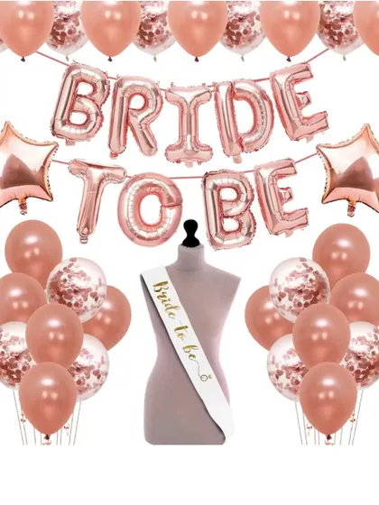 A "Bride to be" decoration kit with rose gold foil balloons and a sash. I can provide all the elements needed for a fun and stylish bachelorette party or bridal shower.