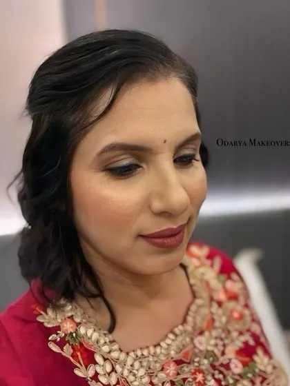 A close-up of the makeup, showing the soft eye makeup and the perfectly blended base.