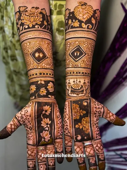 A full view of a special baby shower mehendi, incorporating baby feet, a cradle, and a portrait of Balakrishna, celebrating the new life to come.
