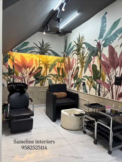 For the shampoo and pedicure section, we used a vibrant, tropical wallpaper and lower wall moulding to create a distinct, relaxing zone. Even in a small corner, we designed a space that feels like a mini-getaway for clients.