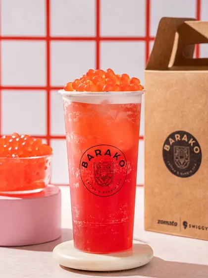 A strawberry popping boba tea from Barako. The red and pink colour scheme creates a sweet and inviting image.