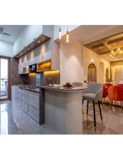 This open-concept design seamlessly connects the kitchen, breakfast bar, and dining area, creating a fluid and social heart of the home. We focused on a sophisticated grey palette, layered lighting, and high-end finishes to merge functionality with timeless style.