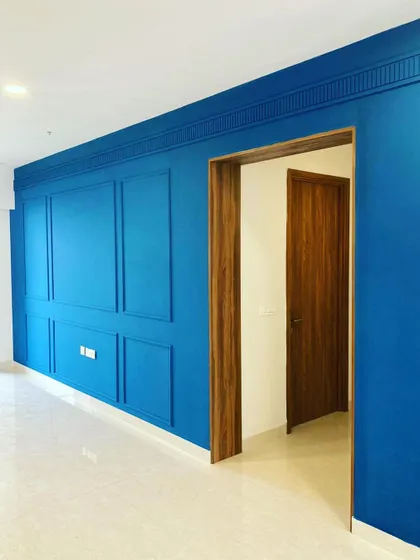 Another view of the stunning blue accent wall, showing how it transforms the entire feel of the living space.