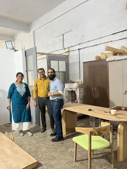 A happy client visiting my workshop to see their new dining table and chair. I always welcome clients to see their furniture in person before delivery. It’s the best way to ensure they are completely satisfied with the craftsmanship.