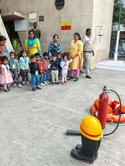 Learning about fire safety equipment like extinguishers and the station bell. Our visit was a comprehensive look into the life of a firefighter.