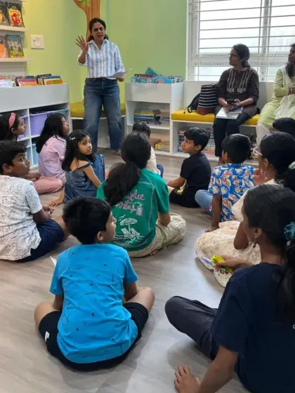 An author interacting with an attentive group of young readers during our 'hOle Book Habba'. These interactions are invaluable for inspiring the next generation of writers.