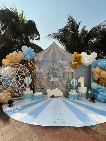 Cotton candy skies and carnival highs! A beautiful pastel carnival-themed backdrop for a first birthday, featuring a carousel, ferris wheel, and hot air balloons.