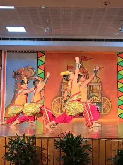 Students performing a warrior sequence from Mayurbhanj Chhau, showcasing their strength and coordination.