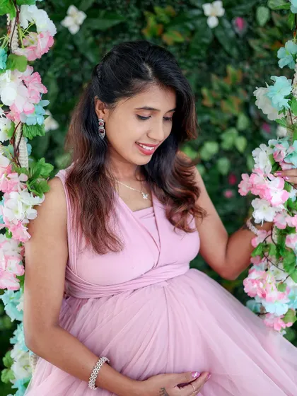 A close-up shot on our floral swing, showing the detail of the pink gown and the beautiful floral arrangement.