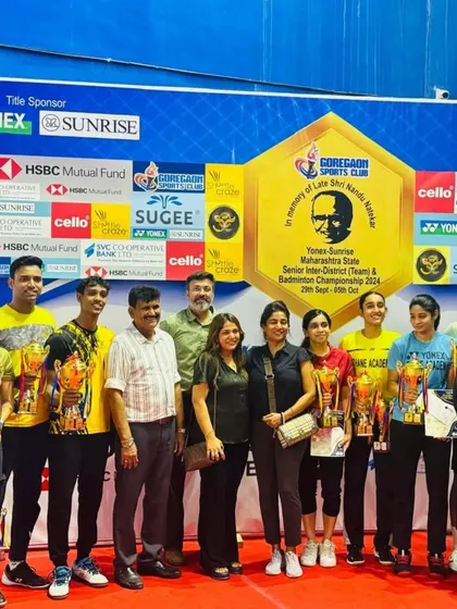 A group photo of all the champions from the final day presentation of the state-level badminton tournament, celebrating their skill and determination.