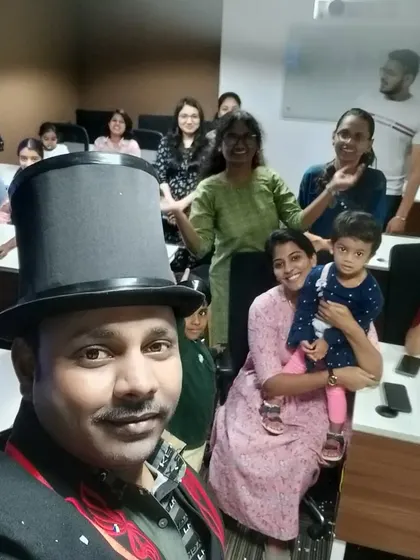 A quick selfie with a happy crowd after an intimate office magic show. This format is great for smaller teams and department gatherings.