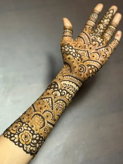 This is a detailed view of my intricate bridal henna work. Each design is unique, combining traditional patterns like paisleys and mandalas with fine-line fillers to create a stunning, full-coverage look for your special day.