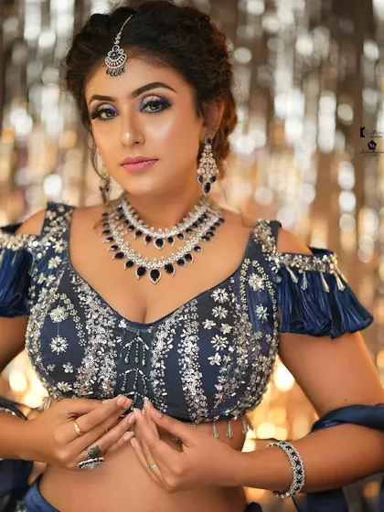 This navy blue lehenga is paired with a dramatic smokey eye and intricate jewelry, a look created in Pro Batch 20.