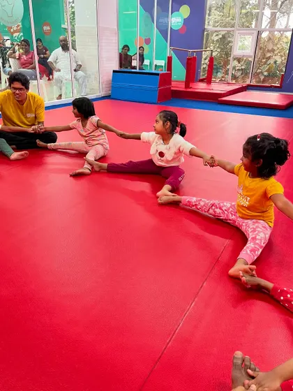 Stretching together makes it more fun. These students are working on their flexibility as a group, encouraging each other and building a sense of teamwork.
