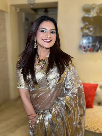 A smiling portrait that shows off her beautiful makeup and confident energy. The look is perfect for a party or festive celebration.