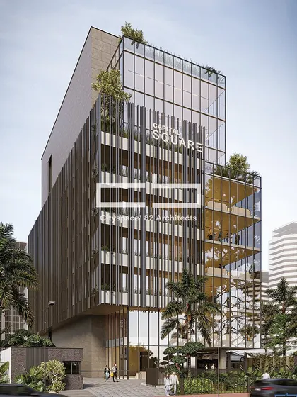 This commercial building, Capital Square, features a volumetric design with a distinctive metal screen covering one section. The design harmonizes modern aesthetics with sustainable elements, creating a visually captivating urban landmark.