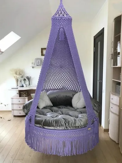 This single seater swing in a lovely lavender color is perfect for an attic room or a cozy corner. The simple design is both elegant and comfortable.