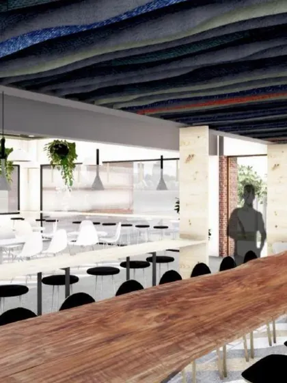 This render shows the canteen design for the Jaipuria Institute of Management, Jaipur. A long, communal table made from a single log of wood acts as a centerpiece, encouraging interaction and collaboration among students.