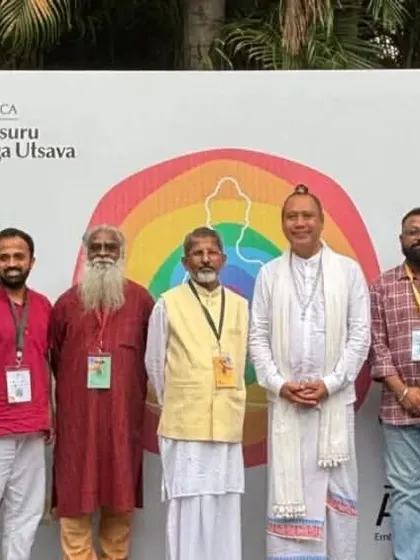 A group photo with fellow teachers and acharyas at the Mysuru Yoga Utsava. Events like these are vital for sharing knowledge and fostering a sense of unity within the global yoga community.