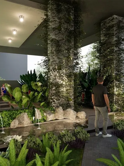 This zen garden is located in the basement level of Marian Park, transforming a typically utilitarian space into a tranquil retreat. The design features a waterbody, creeper-covered columns, and a yoga deck, offering a quiet space for meditation.