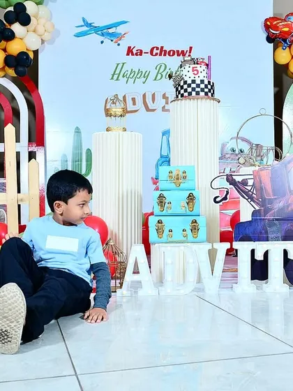 The birthday boy, Advith, enjoying his 'Cars' themed party. It's wonderful to see the kids interacting with the world I've built for them.