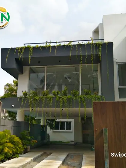 We help businesses make a powerful first impression by integrating lush greenery with their architecture. For this modern building, we designed and installed cascading plants that soften the structure and create a vibrant, welcoming facade.