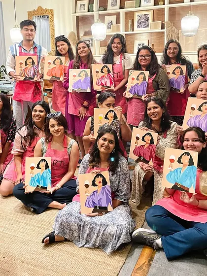 A full group shot from a popular sip and paint workshop. The combination of art, friends, and drinks is always a winner.