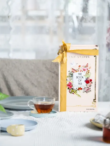 A serene lifestyle scene with "The Book of Tea" on a breakfast table, creating a calm and inviting atmosphere.